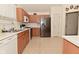 Bright kitchen with appliances, ample cabinet space, and tile floor at 11541 Coastal Dr, Indianapolis, IN 46229