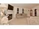 Spacious living room with a fireplace, TV, and comfortable beige sofa at 11541 Coastal Dr, Indianapolis, IN 46229