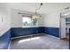 Inviting dining room with stylish lighting, fresh paint, and bright window views at 1171 S Daisy Ln, New Palestine, IN 46163