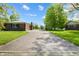 View of house showing concrete driveway leading to garage and grassy lawn under a sunny, blue sky at 1171 S Daisy Ln, New Palestine, IN 46163