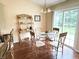 Breakfast nook with hardwood floors, modern chandelier, table, and easy access to the kitchen at 11821 Bills Ave, Fishers, IN 46037