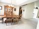 Dining room featuring wood furniture, a decorative hutch, neutral paint, and views into the living areas at 11821 Bills Ave, Fishers, IN 46037