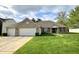 Charming brick home with a well-manicured lawn, a two-car garage, and inviting curb appeal at 11821 Bills Ave, Fishers, IN 46037