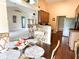 Kitchen and breakfast area with stainless steel appliances, hardwood floors, breakfast bar, and ample cabinet space at 11821 Bills Ave, Fishers, IN 46037