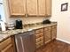 Kitchen features stainless steel dishwasher, granite countertops, and wood cabinets at 11821 Bills Ave, Fishers, IN 46037