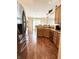 Kitchen features stainless steel appliances, granite countertops and wood floors at 11821 Bills Ave, Fishers, IN 46037