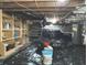 Crawl space featuring a vapor barrier, shelving, utilities, and support structure at 125 Howard St, Greenfield, IN 46140