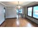 Inviting dining room with hardwood floors, crown molding, and modern light fixture, perfect for entertaining at 125 Howard St, Greenfield, IN 46140