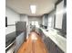 Well-designed kitchen with stainless steel appliances, gray cabinetry, and ample counter space for meal preparation at 125 Howard St, Greenfield, IN 46140