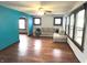 Bright living room with hardwood floors, neutral sectional sofa, and an archway at 125 Howard St, Greenfield, IN 46140