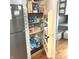 Walk-in pantry beside refrigerator featuring well organized shelves, perfect for storage at 125 Howard St, Greenfield, IN 46140