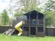 Playground with stairs, slide, and wooden fence on a grassy lawn at 125 Howard St, Greenfield, IN 46140