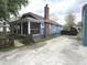 A charming home with a covered front porch and a gravel driveway at 125 Howard St, Greenfield, IN 46140