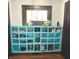 Built-in blue shoe storage shelves near front door at 125 Howard St, Greenfield, IN 46140