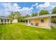 Well-maintained backyard with a covered patio and a barbecue grill at 1324 Chesterfield Dr, Anderson, IN 46012