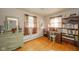 Bedroom with two windows, wooden floor, desk, dresser and bookshelf at 1324 Chesterfield Dr, Anderson, IN 46012