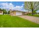 Charming brick home with a two-car garage and well-manicured lawn at 1324 Chesterfield Dr, Anderson, IN 46012