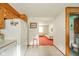 A kitchen transitioning to a living room and half bathroom with tiled floor at 1324 Chesterfield Dr, Anderson, IN 46012