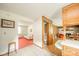 A view into the living room and half bathroom from the kitchen at 1324 Chesterfield Dr, Anderson, IN 46012