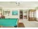A recreation room with a pool table, and large cabinet at 1324 Chesterfield Dr, Anderson, IN 46012