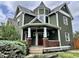 Charming two-story home featuring a unique turret design and a welcoming front porch at 1328 Sturm Ave, Indianapolis, IN 46202