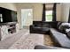 Comfortable living room featuring a sectional sofa and a TV with decorative stand at 1328 Sturm Ave, Indianapolis, IN 46202