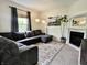Comfortable living room featuring a fireplace and a sectional sofa with lots of natural light at 1328 Sturm Ave, Indianapolis, IN 46202