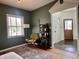 Cozy living room with bookshelf and vintage chair at 1328 Sturm Ave, Indianapolis, IN 46202