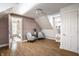 Large bonus room with hardwood floors and natural light from the windows at 139 N East St, Pendleton, IN 46064