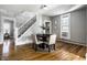 Comfortable dining area featuring a round table with seating for four, nestled beside a staircase at 139 N East St, Pendleton, IN 46064