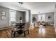 Inviting dining area with modern table set and hardwood floors, seamlessly connected to the living room at 139 N East St, Pendleton, IN 46064