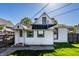 Home exterior with white siding, green lawn, and fenced yard at 139 N East St, Pendleton, IN 46064