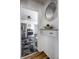Hallway view into a well-equipped kitchen featuring stainless steel appliances at 139 N East St, Pendleton, IN 46064