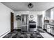 The kitchen boasts stainless steel appliances, ample cabinet space, and stylish checkerboard flooring at 139 N East St, Pendleton, IN 46064