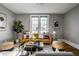 Inviting living room with a comfortable leather sofa, modern decor, and plenty of natural light at 139 N East St, Pendleton, IN 46064