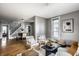 Open-concept living room showcasing hardwood floors, natural light, and a view into the dining area at 139 N East St, Pendleton, IN 46064