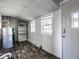 Utility room featuring vinyl flooring, a water heater, and built in storage at 139 N East St, Pendleton, IN 46064