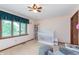 Charming bedroom with a crib, bookshelf, and a serene atmosphere at 1421 Stoney Creek Cir, Carmel, IN 46032