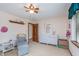 Comfortable bedroom featuring a cozy chair, dresser and ample natural light at 1421 Stoney Creek Cir, Carmel, IN 46032