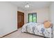 Cozy bedroom featuring a comfortable bed, natural light, and a view of the outdoors at 1421 Stoney Creek Cir, Carmel, IN 46032