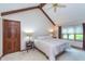Bedroom with vaulted ceiling, ceiling fan, and large bed at 1421 Stoney Creek Cir, Carmel, IN 46032