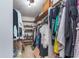 Well-organized walk-in closet with shelving and ample storage for clothes and accessories at 1421 Stoney Creek Cir, Carmel, IN 46032