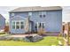 Rear exterior showcasing the home's architecture, yard and the outdoor living spaces at 14584 Hinton Dr, Fishers, IN 46037