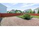 Spacious backyard featuring a brick patio, dark mulch bed and a playset at 14584 Hinton Dr, Fishers, IN 46037