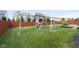 Backyard featuring a playset and lush lawn at 14584 Hinton Dr, Fishers, IN 46037