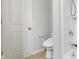Clean bathroom features a toilet, sink and shower with neutral color palette at 14584 Hinton Dr, Fishers, IN 46037