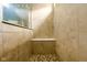 Tiled shower stall featuring a built-in bench seat at 14584 Hinton Dr, Fishers, IN 46037