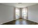 Bedroom features wood floors, neutral paint, and two windows at 14584 Hinton Dr, Fishers, IN 46037