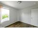 The bedroom has neutral paint and wood floors at 14584 Hinton Dr, Fishers, IN 46037
