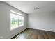 Bedroom featuring wood floors, large window, and neutral wall color at 14584 Hinton Dr, Fishers, IN 46037